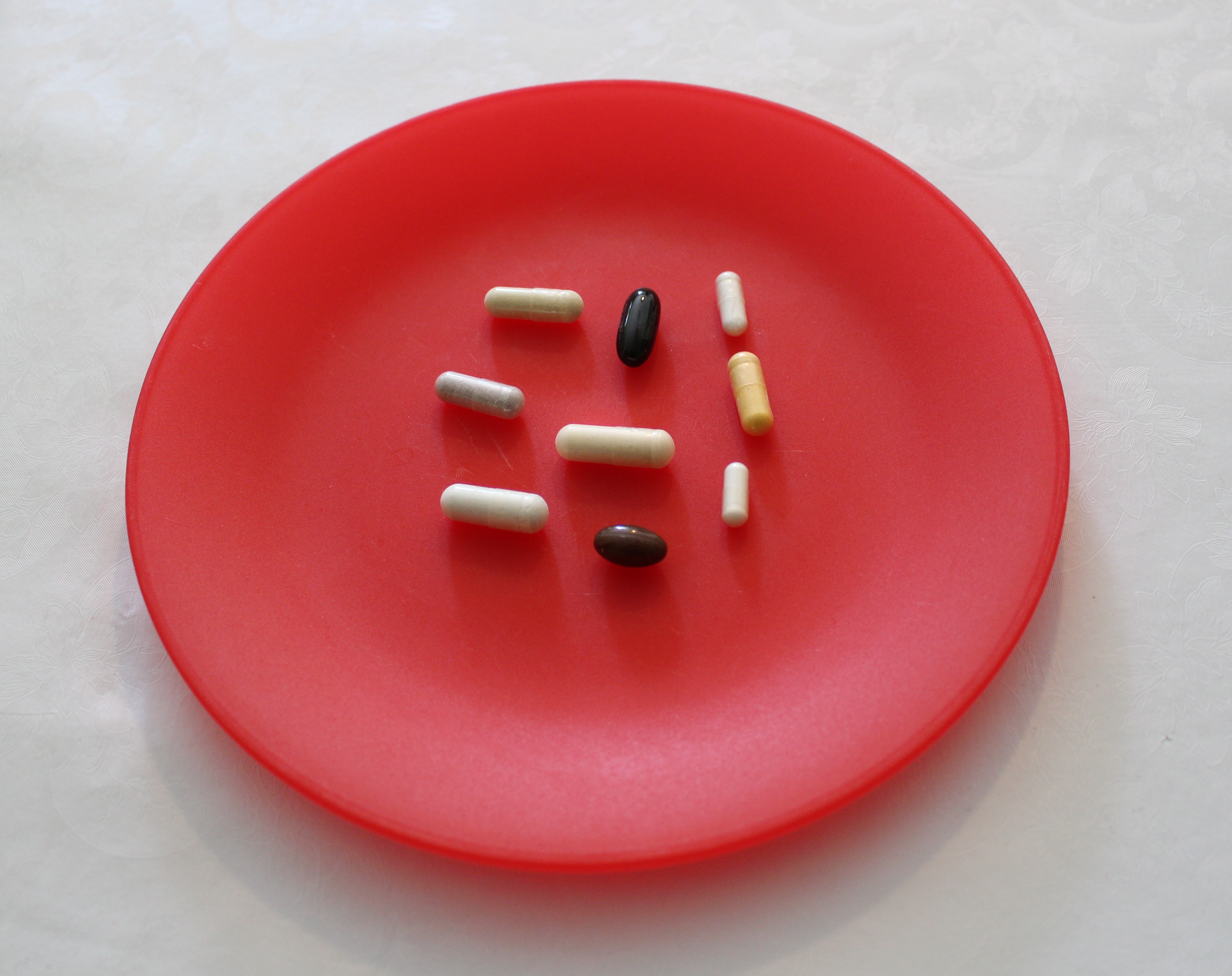 Vitamins on Red Dish