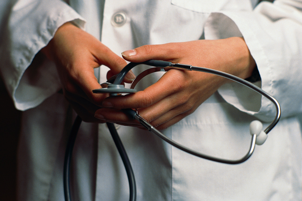 Doctor Hands Holding Stethascope
