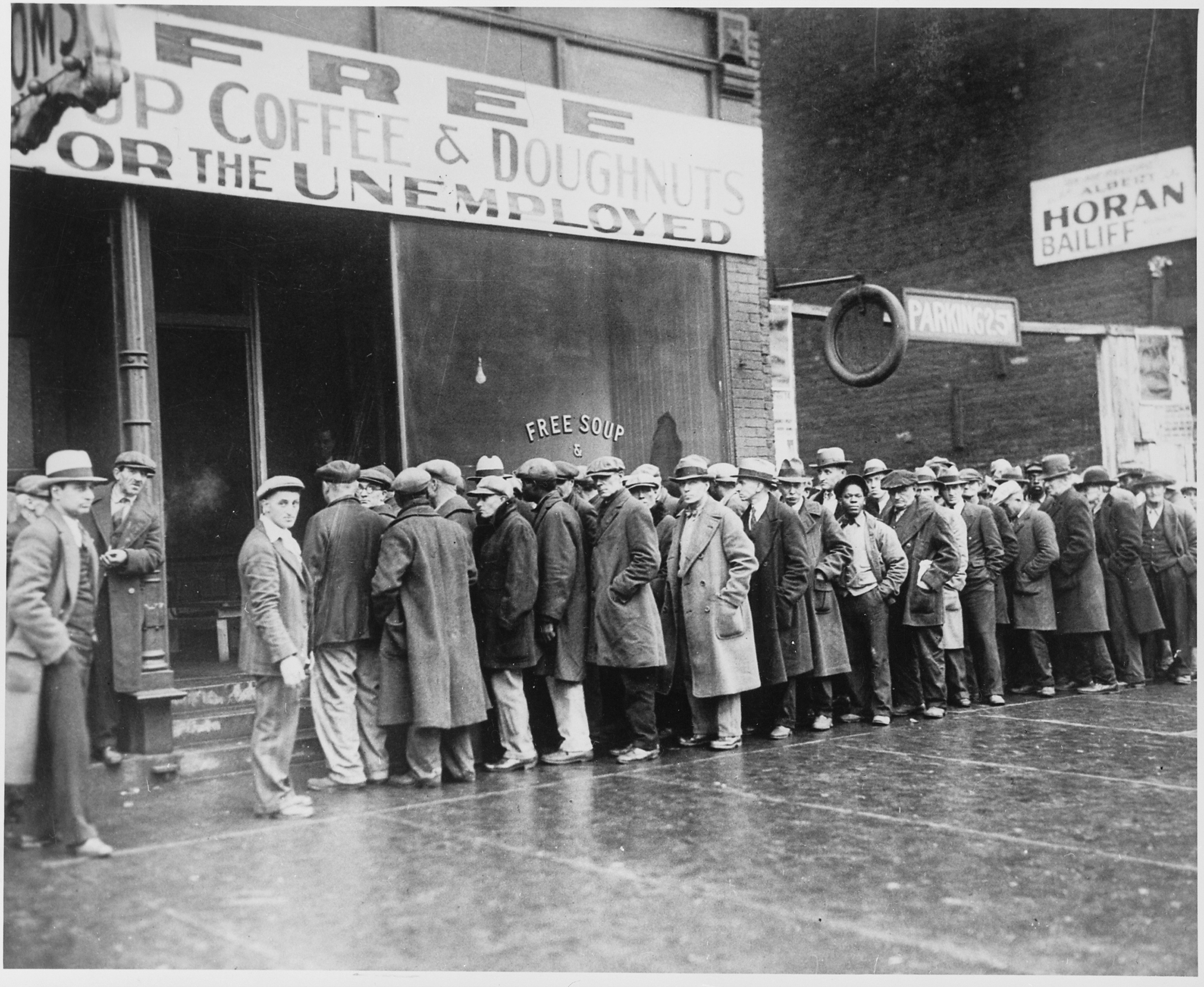 Unemployed_men_queued_outside_a_depression_soup_kitchen_opened_in_Chicago_by_Al_Capone_02-1931_-_NARA_-_541927
