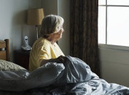 Senior Citizen Looking Out the Window in a Nursing Home