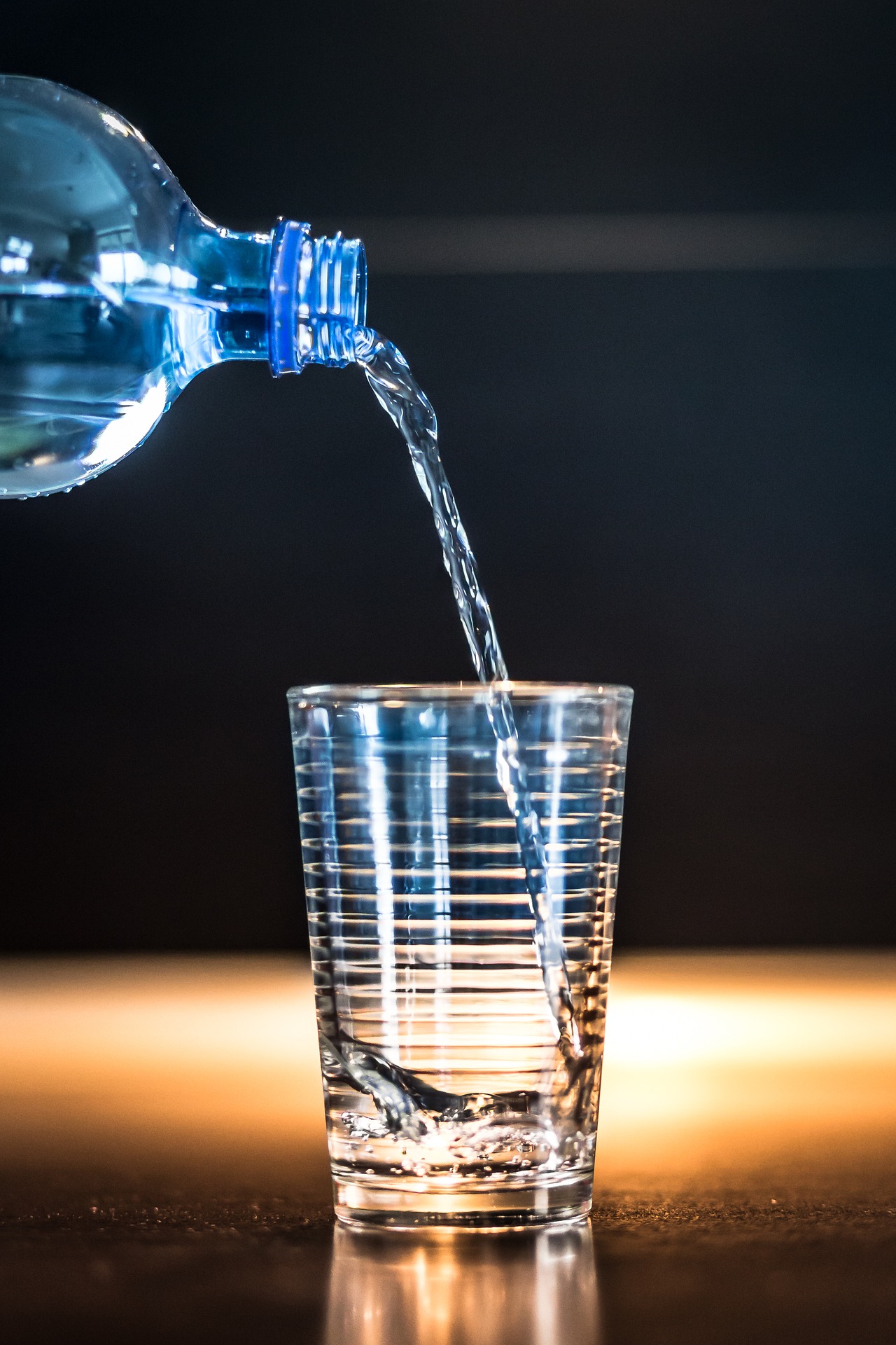 Water Being Poured From a Water Bottle into a Glass-2105211_1920