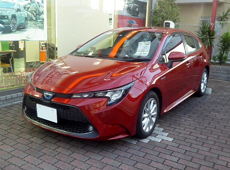 Toyota_COROLLA_HYBRID Red Parked New_S_2WD_(6AA-ZWE211-AEXEB)_front