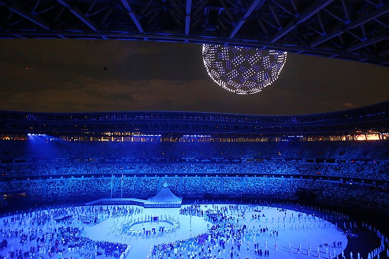 With the Olympics, the world goes on – or does it? Olympics 2020 in Tokyo Opening Ceremony With Drones Creating Symbol