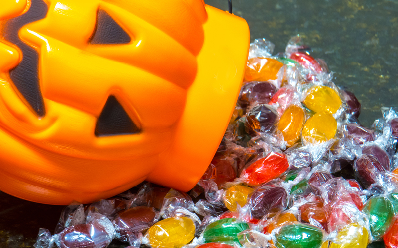 Halloween Candy Spilling From Pumpkin