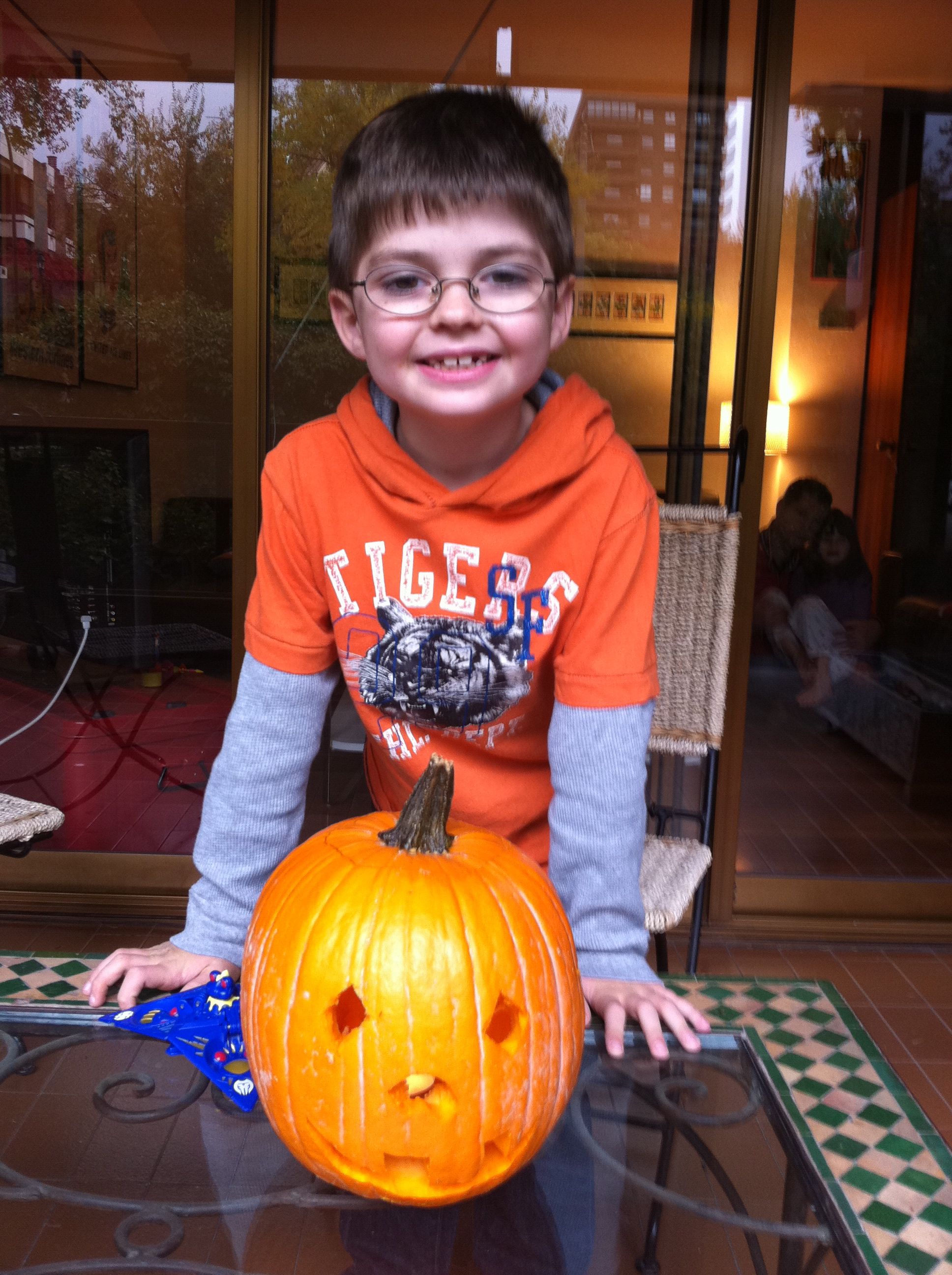 Pumpkin Carved Boy in Orange Shirt and a Big Smile