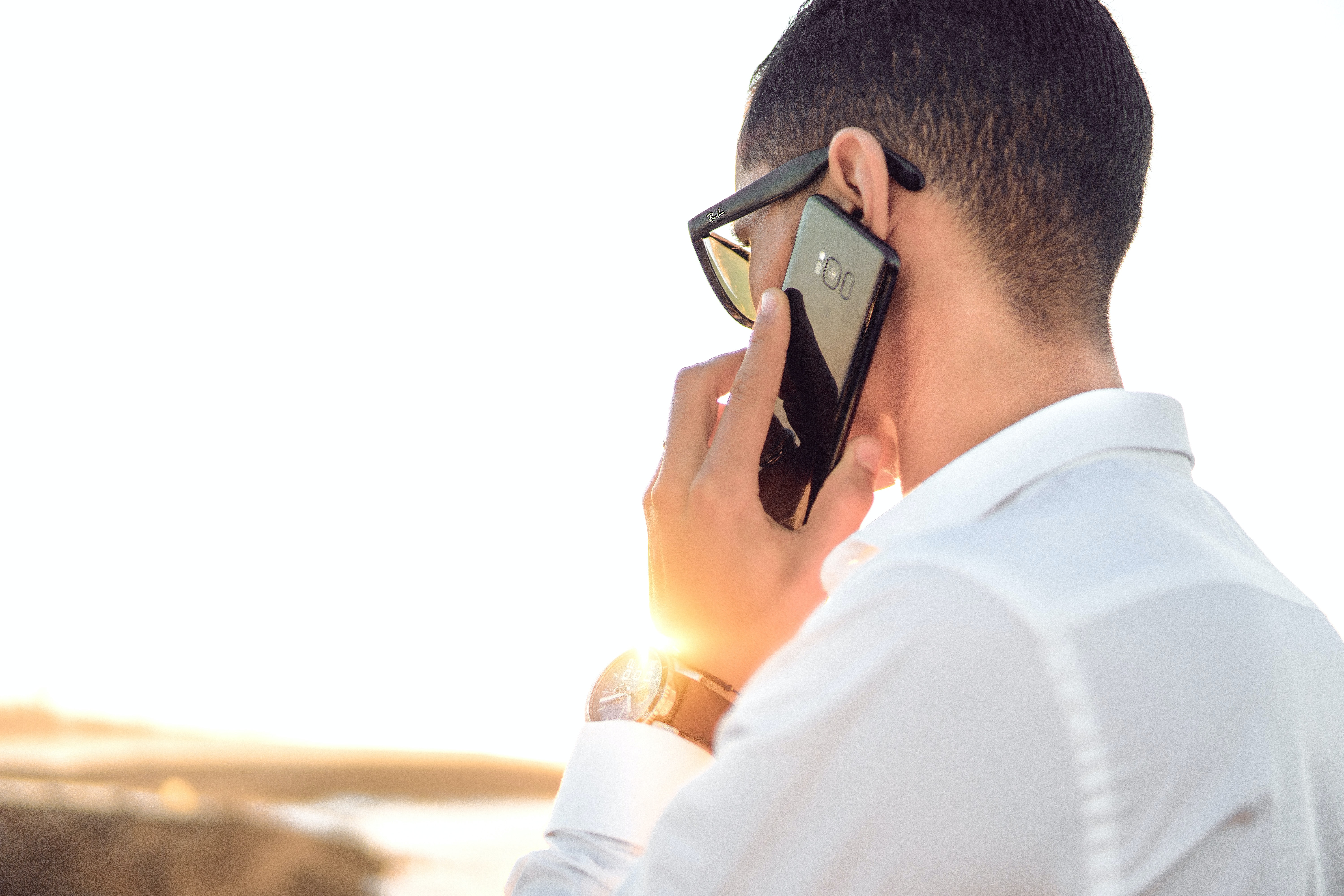 Call Center Man White Shirt Holding Cell Phone