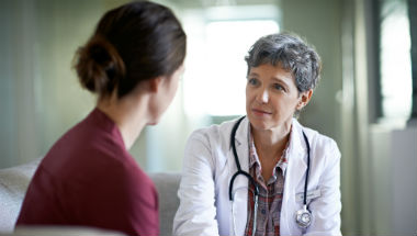Doctor and concerned woman patient 380x215