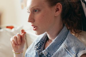 close up photo of a woman in denim top