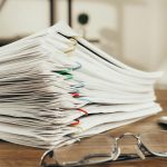 a close up shot of paper clipped documents