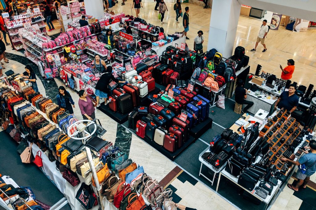 display of suitcases purses and backpacks