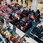 display of suitcases purses and backpacks