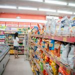 Californians will get a ‘non-ultra-processed’ food label, if bill is signed by Gov. Newsom woman standing at end of aisle in supermarket