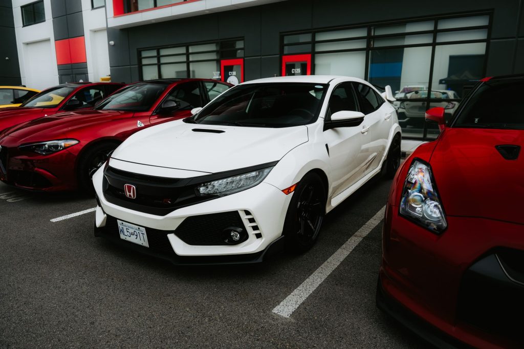 sleek sports cars parked outside modern building