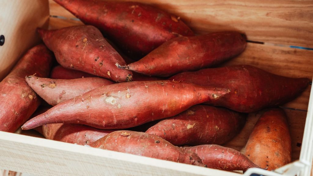 sweet potatoes in a crate